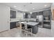 Modern kitchen featuring white countertops, a large kitchen island, stainless appliances, and pendant lighting at 160 Lilt Ave, Henderson, NV 89011