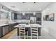 Modern kitchen featuring white countertops, a large kitchen island, stainless appliances, and pendant lighting at 160 Lilt Ave, Henderson, NV 89011