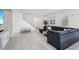 Comfortable open-concept living room featuring cozy sectional sofa and staircase at 160 Lilt Ave, Henderson, NV 89011