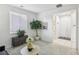 Bright living room featuring a large window and a decorative plant at 160 Lilt Ave, Henderson, NV 89011