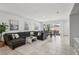 Open-concept living and dining space with large sectional sofa at 160 Lilt Ave, Henderson, NV 89011