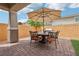 Inviting patio featuring a dining set, perfect for outdoor entertaining, all set on brick pavers at 160 Lilt Ave, Henderson, NV 89011