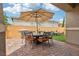 Charming patio area featuring a dining set, grill, and space for relaxation, perfect for outdoor living at 160 Lilt Ave, Henderson, NV 89011