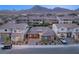 Residential home nestled in a quiet neighborhood, surrounded by manicured lawns and mountain views at 177 Cactus Sunrise St, Las Vegas, NV 89138