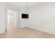 Bright bedroom with wood floors and a wall-mounted television at 177 Cactus Sunrise St, Las Vegas, NV 89138
