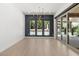 Bright dining room with views of pool through large windows and glass sliding doors, for indoor/outdoor living at 177 Cactus Sunrise St, Las Vegas, NV 89138