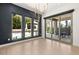 Bright dining room with views of pool through large windows and glass sliding doors, for indoor/outdoor living at 177 Cactus Sunrise St, Las Vegas, NV 89138