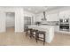 Spacious kitchen with white cabinets, stainless steel appliances, and a large island with bar seating at 177 Cactus Sunrise St, Las Vegas, NV 89138