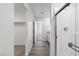 Bathroom showcases a glass-enclosed shower and offers a glimpse into an organized walk-in closet at 2606 Lily Point St, Las Vegas, NV 89156