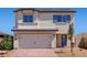 Charming two-story home featuring a spacious two-car garage and a well-manicured front yard, perfect for Gathering living at 2606 Lily Point St, Las Vegas, NV 89156