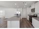 Stylish kitchen with stainless steel appliances, gray countertops, and sleek cabinetry for a contemporary cooking space at 2606 Lily Point St, Las Vegas, NV 89156
