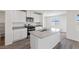 Modern kitchen with gray countertops, stainless steel appliances, and ample cabinetry, creating an efficient cooking space at 2606 Lily Point St, Las Vegas, NV 89156