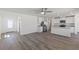 Open-concept living area featuring an eat-in kitchen with stainless steel appliances and vinyl plank flooring at 2606 Lily Point St, Las Vegas, NV 89156