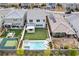 Aerial view of backyard, with pool, sports court, patio, manicured lawns, and outdoor furniture at 2616 Tolmezzo St, Henderson, NV 89044