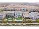 An aerial view of a home with a pool, sport court, and desert landscaping at 2616 Tolmezzo St, Henderson, NV 89044
