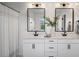 Modern bathroom featuring double sinks, quartz countertops, and stylish fixtures at 2616 Tolmezzo St, Henderson, NV 89044