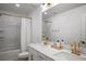 Bright bathroom with double sinks, white countertops, and gold hardware at 2616 Tolmezzo St, Henderson, NV 89044