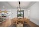 Open-concept dining area with a wooden table and chairs, flowing into the kitchen at 2616 Tolmezzo St, Henderson, NV 89044