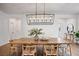 Bright dining room features a wood table, elegant lighting, and neutral decor at 2616 Tolmezzo St, Henderson, NV 89044