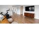 Cozy living space with stylish decor, wood floors, and a modern entertainment center at 2616 Tolmezzo St, Henderson, NV 89044