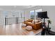 Upstairs living area with leather couch, exercise bike, and natural light at 2616 Tolmezzo St, Henderson, NV 89044
