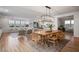 Open-concept living and dining space featuring hardwood floors and lots of natural light, perfect for entertaining at 2616 Tolmezzo St, Henderson, NV 89044