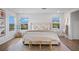 Bright main bedroom featuring plush bedding, natural light, and elegant decor at 2616 Tolmezzo St, Henderson, NV 89044