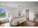 Bright main bedroom featuring plush bedding, natural light, and elegant decor at 2616 Tolmezzo St, Henderson, NV 89044