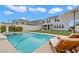 Beautiful backyard with a sparkling pool and inviting lounge chairs at 2616 Tolmezzo St, Henderson, NV 89044