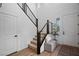 Open staircase with modern railings and a small seating area by the entrance at 2616 Tolmezzo St, Henderson, NV 89044