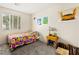 Well-lit bedroom with sports themed decor, carpeted flooring and a window view at 2664 Strichen Ave, Henderson, NV 89044