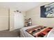 Neutral bedroom featuring wall decor, carpet flooring, and a double door closet at 2664 Strichen Ave, Henderson, NV 89044