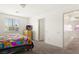 Bright bedroom with natural light, carpeted flooring, and neutral wall color at 2664 Strichen Ave, Henderson, NV 89044