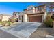 Two-story home with a two-car garage and desert landscaping for low maintenance at 2664 Strichen Ave, Henderson, NV 89044