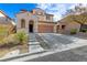 Charming two-story home with a welcoming front entrance and a two-car garage at 2664 Strichen Ave, Henderson, NV 89044