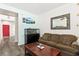 Cozy living room with wood-look floors and lots of light at 2664 Strichen Ave, Henderson, NV 89044