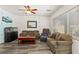 Inviting living room with wood-look floors and ceiling fan at 2664 Strichen Ave, Henderson, NV 89044