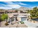 Gorgeous aerial view of a community nestled against mountains under a sunny sky at 2913 Laverton Dr, Las Vegas, NV 89134