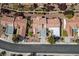 Overhead view of homes with tiled roofs, surrounded by landscaped yards and streets at 2913 Laverton Dr, Las Vegas, NV 89134