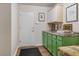 Laundry room with countertop, and cabinets, and next to the entry door at 2913 Laverton Dr, Las Vegas, NV 89134