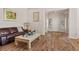 Bright living room with hardwood floors, fresh paint, and natural light illuminating the space at 2913 Laverton Dr, Las Vegas, NV 89134
