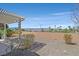 Well-maintained backyard with desert landscaping, a pergola and views at 3036 Monroe Park Rd, Henderson, NV 89052
