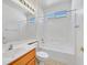 Clean and bright bathroom featuring a shower-tub combo, vanity with sink, and tiled floor at 3036 Monroe Park Rd, Henderson, NV 89052