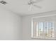 Bright bedroom featuring a ceiling fan and a large window with shutters, offering ample natural light at 3036 Monroe Park Rd, Henderson, NV 89052