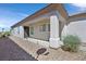 Charming home featuring a covered front porch and desert landscaping for curb appeal at 3036 Monroe Park Rd, Henderson, NV 89052