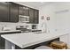 Bright kitchen featuring a stainless steel range, a modern faucet, and sleek quartz countertops at 333 Aravalli Crest St, Henderson, NV 89015