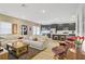 Bright living room featuring a large sectional sofa, modern coffee table, and an open floor plan to the kitchen at 333 Aravalli Crest St, Henderson, NV 89015
