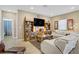 Comfortable living room with a large TV, stylish decor, and plenty of seating space at 333 Aravalli Crest St, Henderson, NV 89015