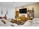 Cozy living room with modern furniture, entertainment center, and hardwood floors at 333 Aravalli Crest St, Henderson, NV 89015
