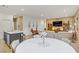 Open-concept living space with the dining area, kitchen island, and a comfortable living room for relaxation at 333 Aravalli Crest St, Henderson, NV 89015